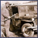 Crewman Lindsey B. Tart, inspects a jeep.